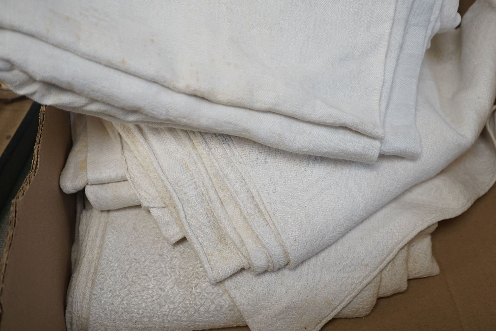 Two French provincial thick linen monogrammed tablecloths and three others.